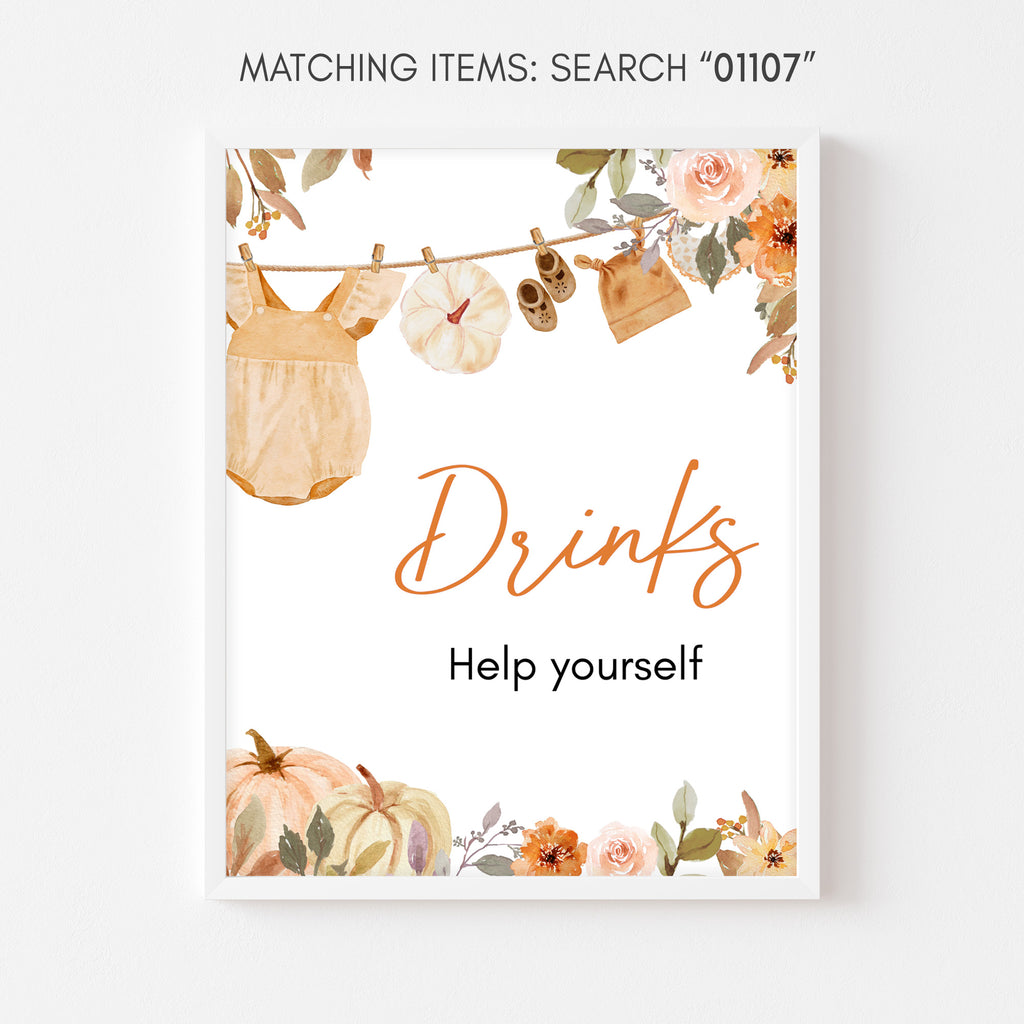 Drinks station sign for fall baby shower with baby outfits on a line and pumpkin accents for rustic party vibes