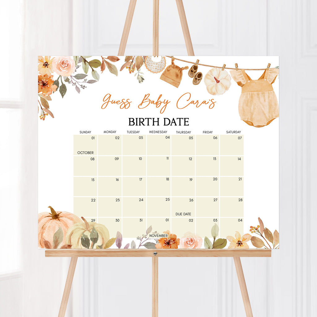 Little pumpkin due date calendar with autumn leaves and baby clothes hanging on a clothesline for fall baby showers