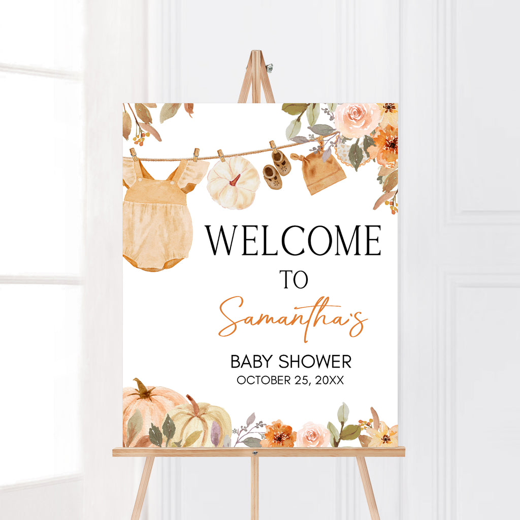 Editable fall baby shower welcome sign with autumn florals and clothesline of baby outfits for a cozy celebration