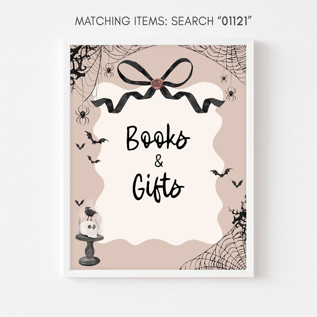 A little boo Halloween-themed books and gifts sign with bats and spider webs in pink and black colors