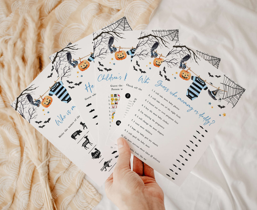 Halloween baby shower game bundle for boys featuring spooky cute designs like bats, spider webs, and pumpkins