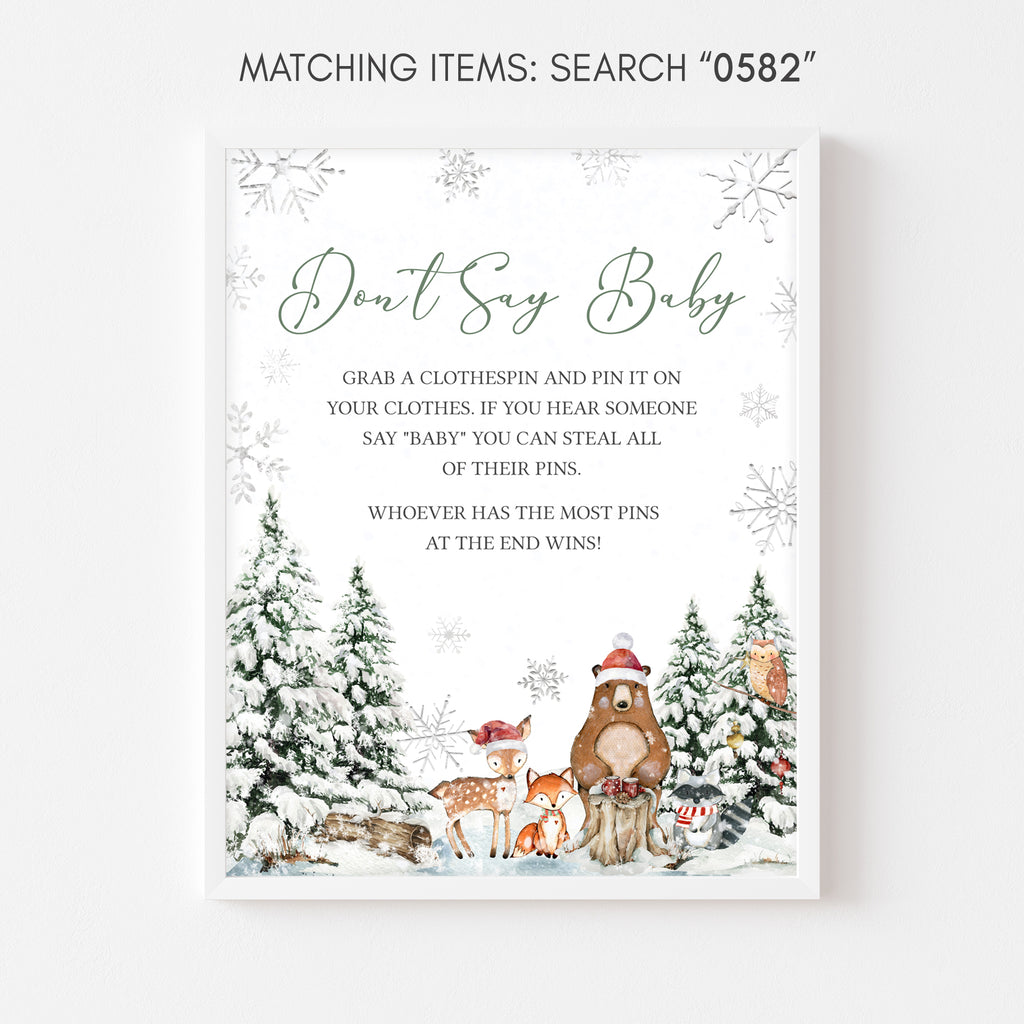 Winter woodland baby shower “Don’t Say Baby” sign with Christmas animals and rustic design
