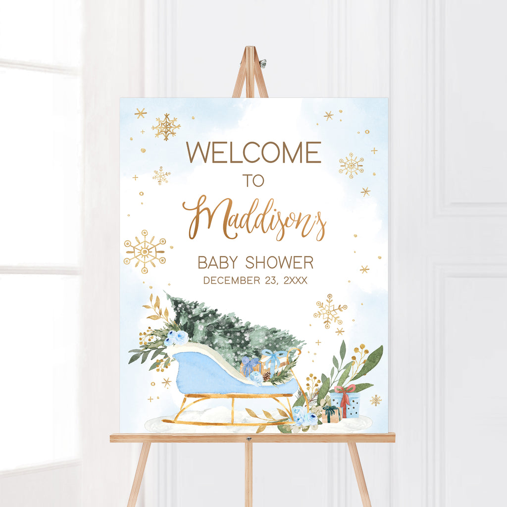 Rustic winter baby shower welcome sign boy with blue sleigh, greenery, and snowflake accents