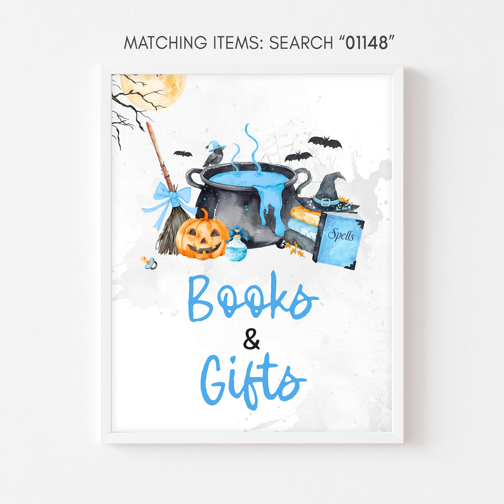 Books and gifts sign, blue Halloween baby shower pumpkin and witch cauldron table decor