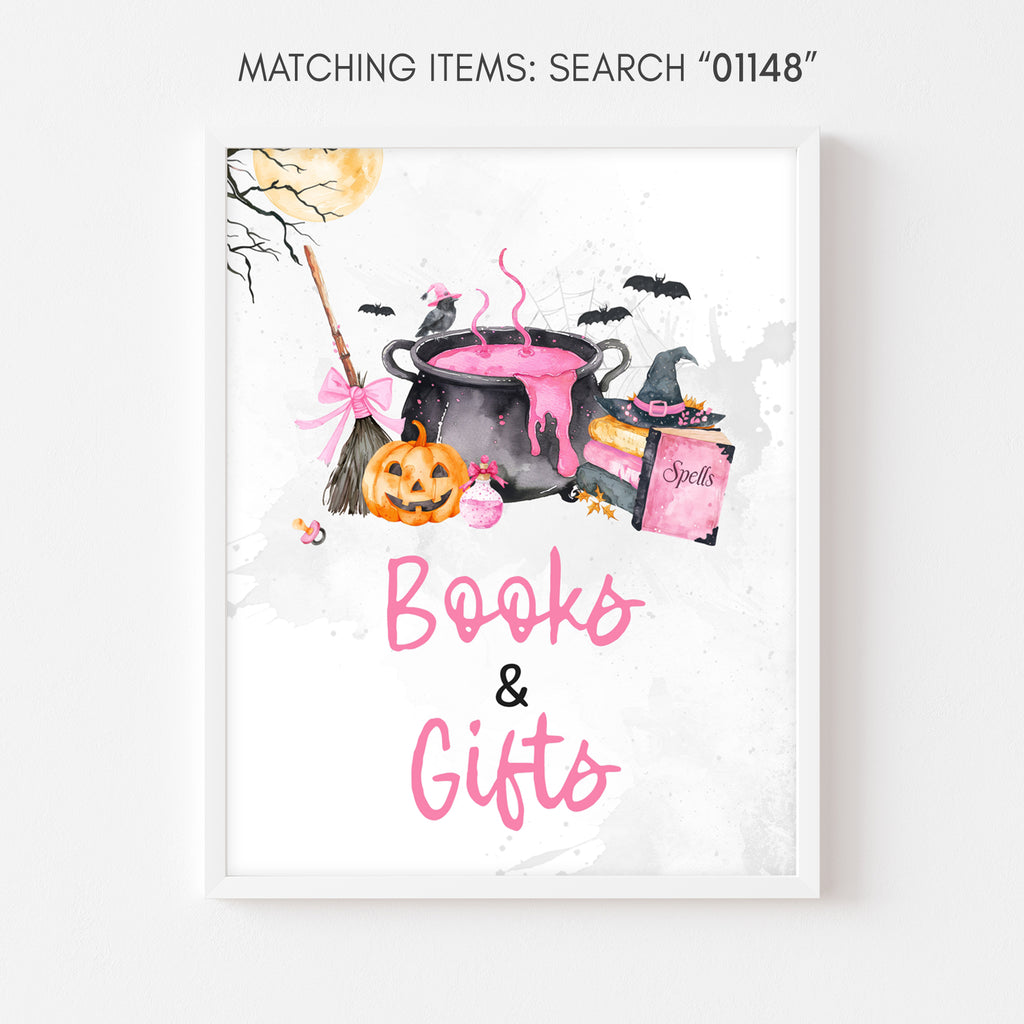 Books and gifts sign, pink Halloween baby shower pumpkin and witch cauldron table decor
