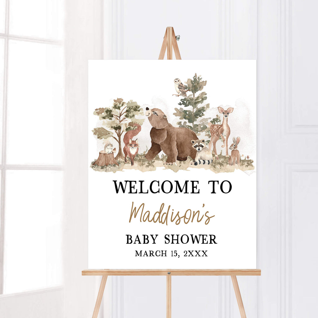 Woodland baby shower welcome sign with forest animals and adventure awaits theme