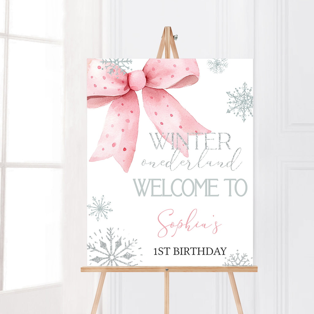 Winter Onederland birthday welcome sign with pink bow and silver snowflakes, printable winter wonderland party welcome sign for girl’s first birthday